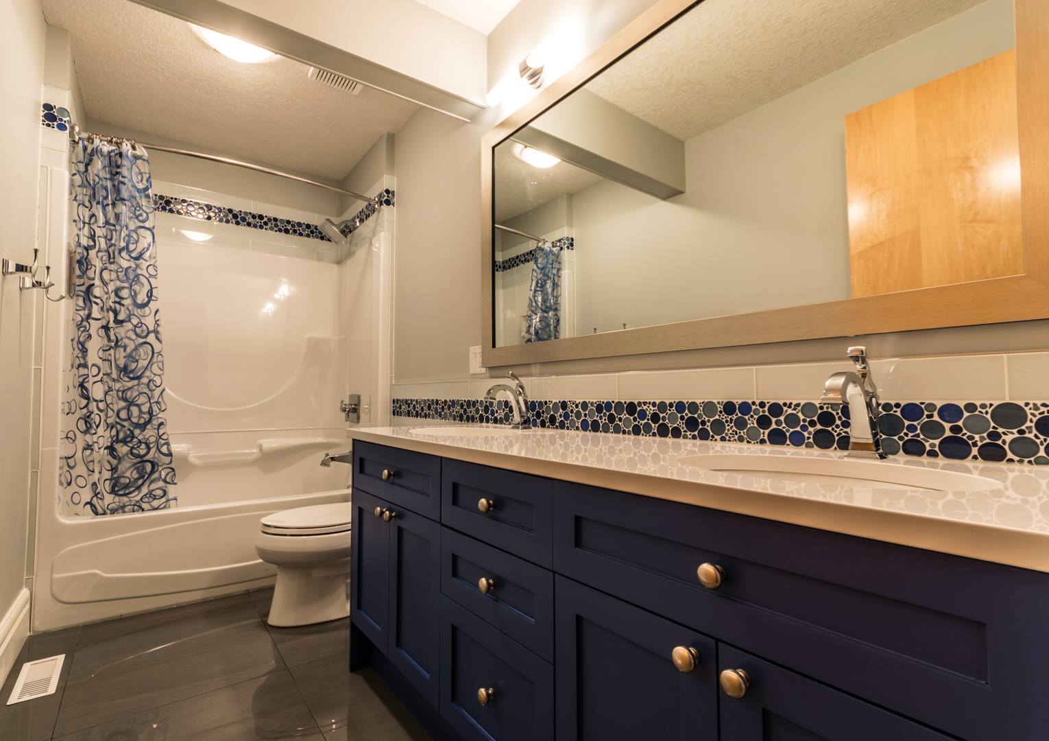 bathroom with blue double vanity